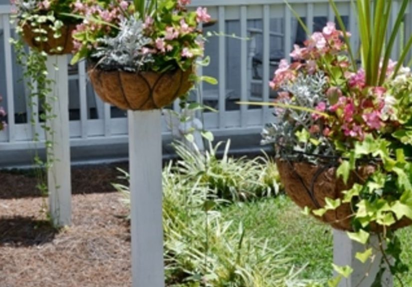 How to Mount Flower Baskets Onto Wooden Posts