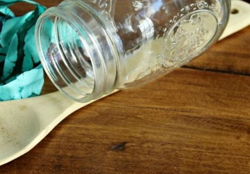 See how to glue a mason jar to a wooden spoon to make your neighbors smile whenever they see this hanging in your yard!